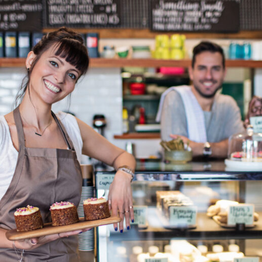 Photo of two people in a coffee shop.