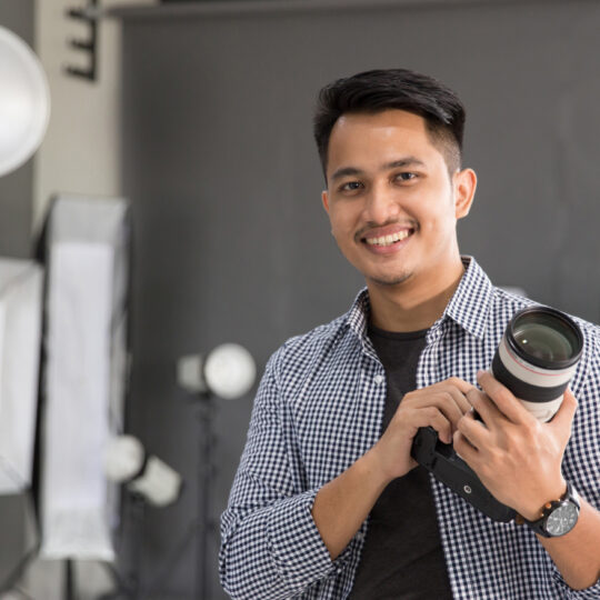 Photo of man with a camera.